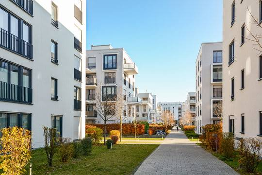 A paved walk between apartment buildings